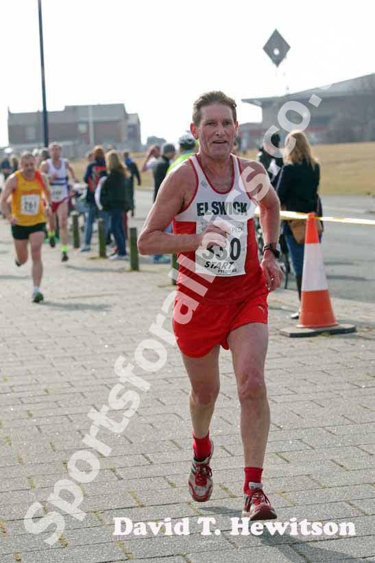 Harry Matthews (Elswick) finishing the Transped Blyth Valley 10k.
